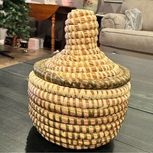 Handwoven sweetgrass coiled basket with a fitted lid